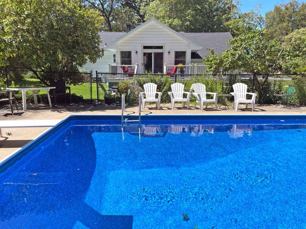 View of a home addition from the pool in Ringwood NJ by White Maple Construction