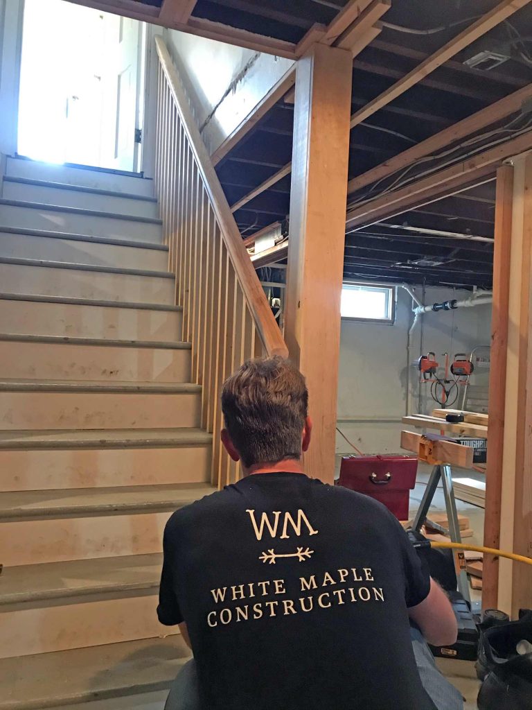 The team at White Maple Construction working on stairs in the basement