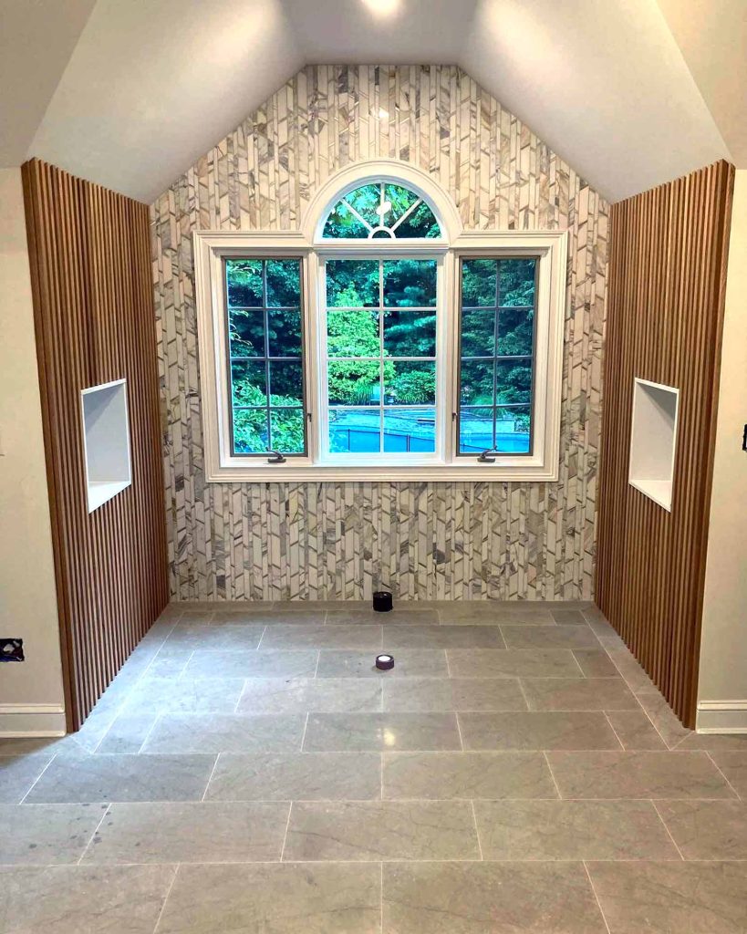 Beautiful mosaic tile and stained wood in a bathroom remodel by White Maple Construction