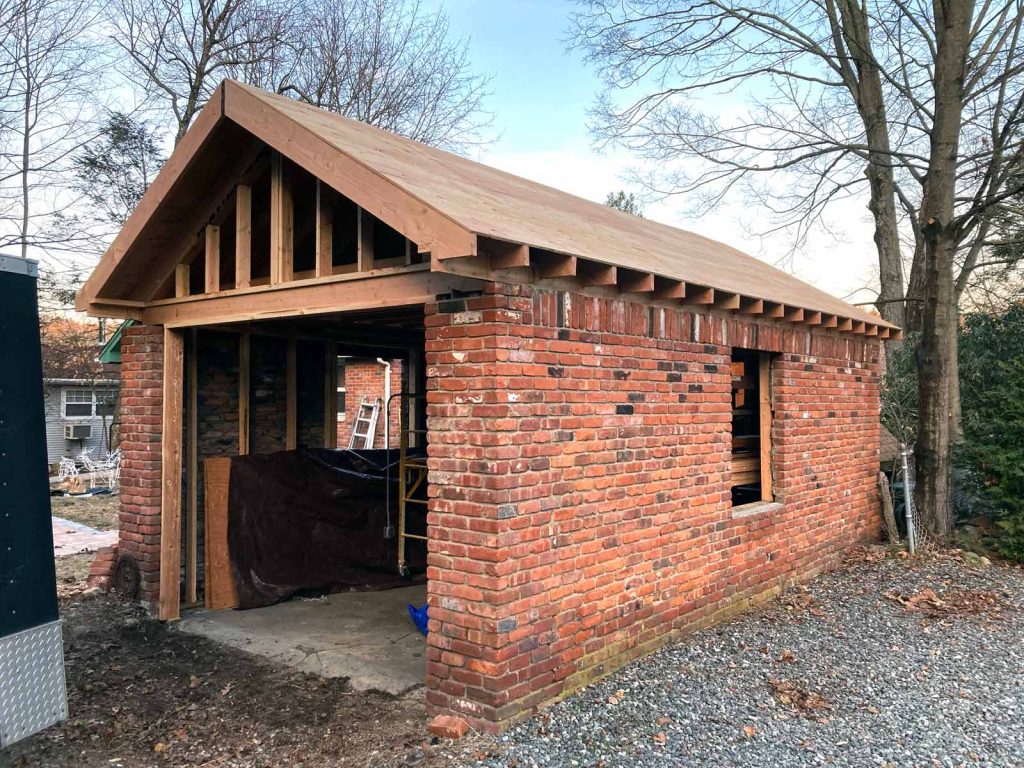 A detached brick garage before it was renovated