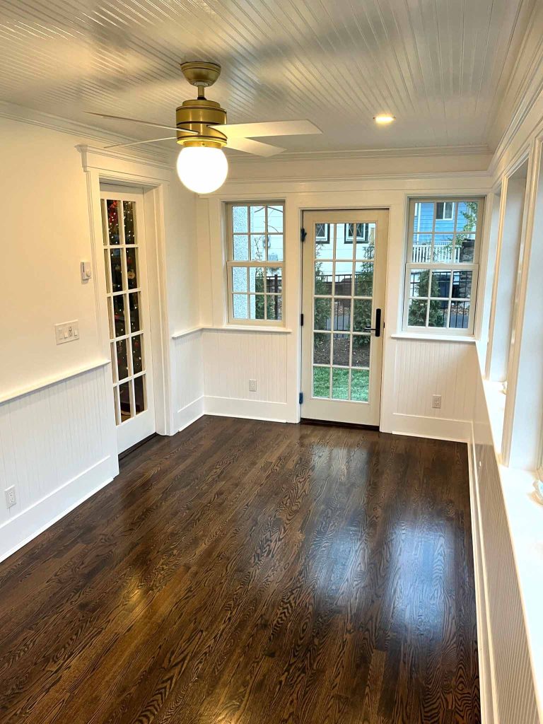 The interior of a sunroom addition by White Maple Construction